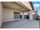 View of covered back patio with ceiling fan and sliding glass doors to the interior at 144 Sarabeth St, Las Vegas, NV 89138