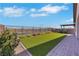 Landscaped backyard featuring artificial grass, hardscape, and mountain views at 144 Sarabeth St, Las Vegas, NV 89138