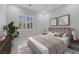 Stylishly staged bedroom with a plush bed, shuttered window and tasteful decor at 144 Sarabeth St, Las Vegas, NV 89138