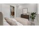 Serene bedroom featuring a closet, dresser, neutral tones, and a cozy bed at 144 Sarabeth St, Las Vegas, NV 89138