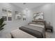 Bright bedroom with shuttered windows, neutral decor, and a comfortable upholstered bench at 144 Sarabeth St, Las Vegas, NV 89138