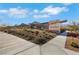 Savannah community entrance with desert landscaping, a brick wall, and views of mountains at 144 Sarabeth St, Las Vegas, NV 89138