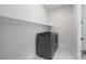 Efficient laundry area with modern washer and dryer, plus convenient shelving at 144 Sarabeth St, Las Vegas, NV 89138