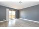 Serene bedroom featuring gray walls, light-colored flooring, and a sliding door at 1844 N Decatur Blvd # 203, Las Vegas, NV 89108