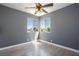 Corner view of the bedroom featuring wood floors, base molding and natural light at 1844 N Decatur Blvd # 203, Las Vegas, NV 89108