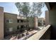 Multi-story condo complex featuring patios and desert landscaping at 1844 N Decatur Blvd # 203, Las Vegas, NV 89108