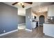 Open concept view of the living room and kitchen with lots of natural light and wood floors at 1844 N Decatur Blvd # 203, Las Vegas, NV 89108