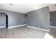 Spacious living room with modern gray walls and light wood-look flooring at 1844 N Decatur Blvd # 203, Las Vegas, NV 89108