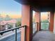 Condo balcony with metal and glass railings and a view of houses at 19 E Agate Ave # 406, Las Vegas, NV 89123