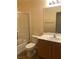 Bathroom with a shower, toilet, sink, and vanity mirror at 19 E Agate Ave # 406, Las Vegas, NV 89123