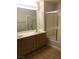 Bathroom features double sinks, a bathtub, and shower at 19 E Agate Ave # 406, Las Vegas, NV 89123