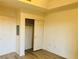 Bedroom with a closet, and a double door to the left at 19 E Agate Ave # 406, Las Vegas, NV 89123