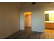 Bedroom with closet and ensuite bathroom featuring wood style flooring at 19 E Agate Ave # 406, Las Vegas, NV 89123