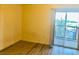 Bright bedroom featuring hardwood floors and a sliding glass door to a balcony at 19 E Agate Ave # 406, Las Vegas, NV 89123