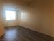 Bedroom with window, neutral walls and hardwood floors at 19 E Agate Ave # 406, Las Vegas, NV 89123