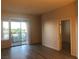 Bright living area with sliding doors to balcony and modern laminate flooring at 19 E Agate Ave # 406, Las Vegas, NV 89123