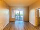 Living room boasts natural light with sliding glass doors leading to an outdoor balcony at 19 E Agate Ave # 406, Las Vegas, NV 89123