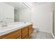 Bathroom featuring double sinks, tile flooring, large mirror, and glass door shower at 1911 Hobson Dr, Henderson, NV 89074