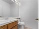 Bathroom featuring a single sink, wooden cabinets, and a large mirror with vanity lighting at 1911 Hobson Dr, Henderson, NV 89074