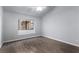 Bright bedroom featuring hardwood floors, a ceiling fan, and a window letting in natural light at 1911 Hobson Dr, Henderson, NV 89074