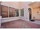 Home exterior featuring a black door and red stone-covered patio at 1911 Hobson Dr, Henderson, NV 89074