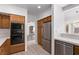 Well-equipped kitchen featuring a stainless steel refrigerator and dishwasher at 1911 Hobson Dr, Henderson, NV 89074