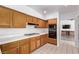 Traditional style kitchen features wood cabinetry, tiled countertops and backsplash, and stainless steel appliances at 1911 Hobson Dr, Henderson, NV 89074