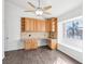 Home office featuring wood floors, built-in cabinets, desk space, and a large window at 1911 Hobson Dr, Henderson, NV 89074