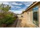 Private backyard featuring a concrete patio and desert landscaping, perfect for relaxing outdoors at 205 Crown Imperial St, Henderson, NV 89074