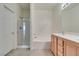 Bathroom with shower, large tub, dual sinks and white vanity at 205 Crown Imperial St, Henderson, NV 89074