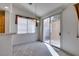 Dining area with natural light, a modern chandelier, and access to the backyard patio at 205 Crown Imperial St, Henderson, NV 89074