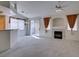 Bright living room featuring a fireplace, carpet flooring, and a bar area at 205 Crown Imperial St, Henderson, NV 89074