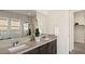 Elegant bathroom showcasing a double vanity with dark cabinets and a sleek countertop, combining style and functionality at 22 Barrio Alto Ct, Henderson, NV 89011