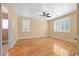 Bedroom with hardwood floors, natural light, and ensuite bathroom at 2213 Midvale Ter, Henderson, NV 89074