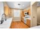 Bright kitchen featuring stainless steel appliances and white tile countertops at 2213 Midvale Ter, Henderson, NV 89074