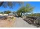 Picturesque walking path with park bench, lush greenery, and a serene atmosphere for outdoor enjoyment at 2213 Midvale Ter, Henderson, NV 89074