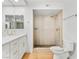 Bright bathroom featuring a new vanity with stone countertop and a modern walk-in shower with gold fixtures at 2620 San Martin Ct, Las Vegas, NV 89121