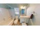 Bright bathroom featuring a shower-tub combo and white vanity with storage space at 2713 Tanagrine Dr, North Las Vegas, NV 89084