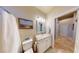 Bathroom view featuring a framed mirror, stone countertops, and a toilet at 2713 Tanagrine Dr, North Las Vegas, NV 89084