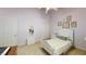 Light purple bedroom featuring a white twin bed, coordinated decor, and a blend of soft textures at 2713 Tanagrine Dr, North Las Vegas, NV 89084