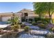 Beautifully landscaped front yard with stone steps leading to the entrance at 2713 Tanagrine Dr, North Las Vegas, NV 89084