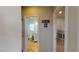 Hallway view to a bathroom and bedroom with bunkbeds in a quaint home at 2713 Tanagrine Dr, North Las Vegas, NV 89084