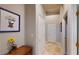 Hallway with neutral walls, tile floors, and decorative accents at 2713 Tanagrine Dr, North Las Vegas, NV 89084