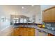 A well-appointed kitchen featuring granite countertops and stainless steel appliances at 2713 Tanagrine Dr, North Las Vegas, NV 89084