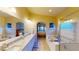 This main bathroom features a soaking tub, shower, double sink vanity and large mirror at 2713 Tanagrine Dr, North Las Vegas, NV 89084