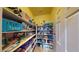 Well-stocked pantry with ample shelving, filled with a variety of household goods and food items at 2713 Tanagrine Dr, North Las Vegas, NV 89084