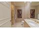Well-lit bathroom features neutral tones, a vanity with sink, a toilet, and a glass-enclosed shower at 2747 Paradise Rd # Ph 3604, Las Vegas, NV 89109