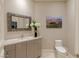 Modern bathroom featuring a stylish vanity, decorative mirror, and contemporary fixtures in a serene setting at 2747 Paradise Rd # Ph 3604, Las Vegas, NV 89109