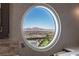 Bathroom with circular window framing a view of mountains and the city at 2747 Paradise Rd # Ph 3604, Las Vegas, NV 89109