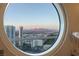 Bathroom featuring a scenic circular window with views of the city and mountains at 2747 Paradise Rd # Ph 3604, Las Vegas, NV 89109